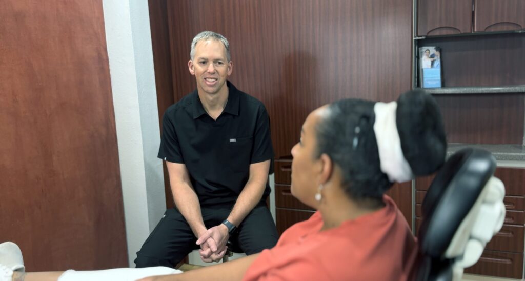 Dentist speaking with a patient at Progressive Dental